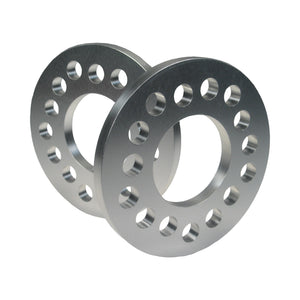 Pair of Pro-Werks billet aluminum wheel spacers, each with a ring of bolt holes and a large open center bore, silver machined finish