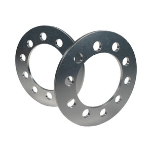 Pair of Pro-Werks billet aluminum wheel spacers, machined silver rings with dual five-bolt hole patterns and a large center bore, overlapped