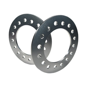 Pair of Pro-Werks billet aluminum wheel spacers, machined silver rings with bolt holes drilled around each face, overlapping
