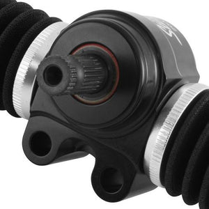 Close-up of a black anodized housing with a splined input shaft, two mounting holes and knurled silver collars on black braided hose sleeving